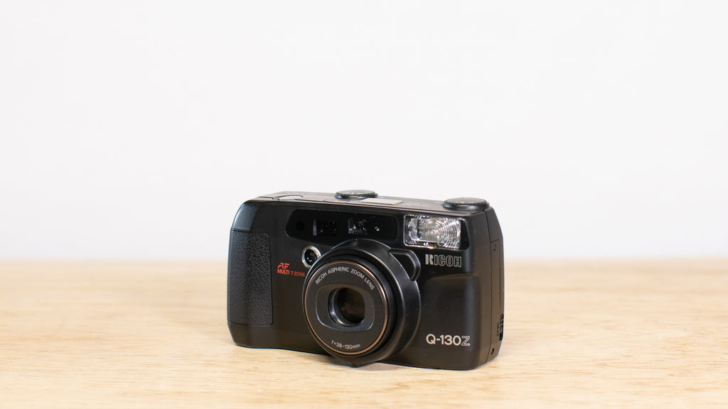 Ricoh Q-130Z 35mm Camera with 38-130mm zoom lens.