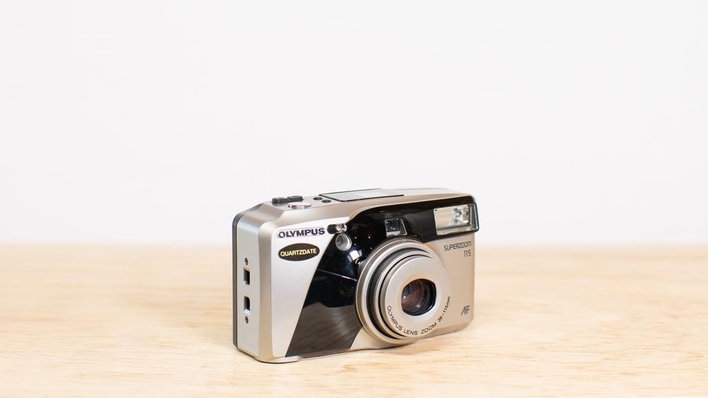 Olympus 38-115mm zoom lens