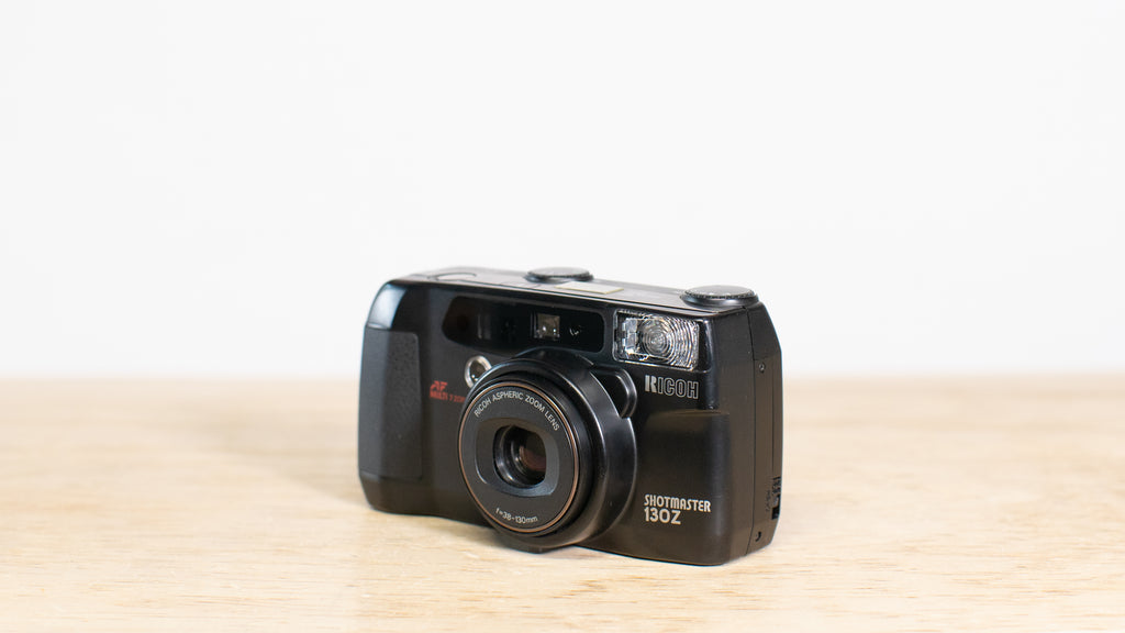 Camera with 38-130mm zoom lens